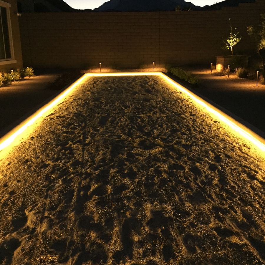 Illuminated bocce ball court during nighttime play