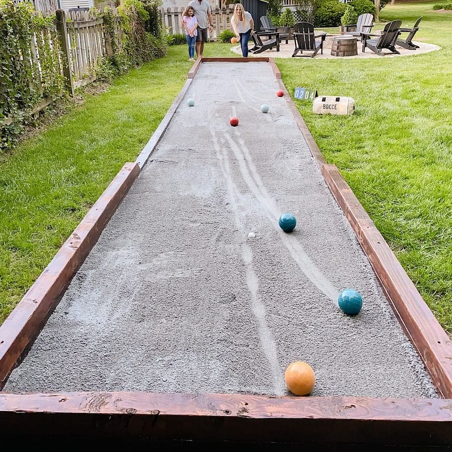 Bocce ball set neatly arranged on a bocce court