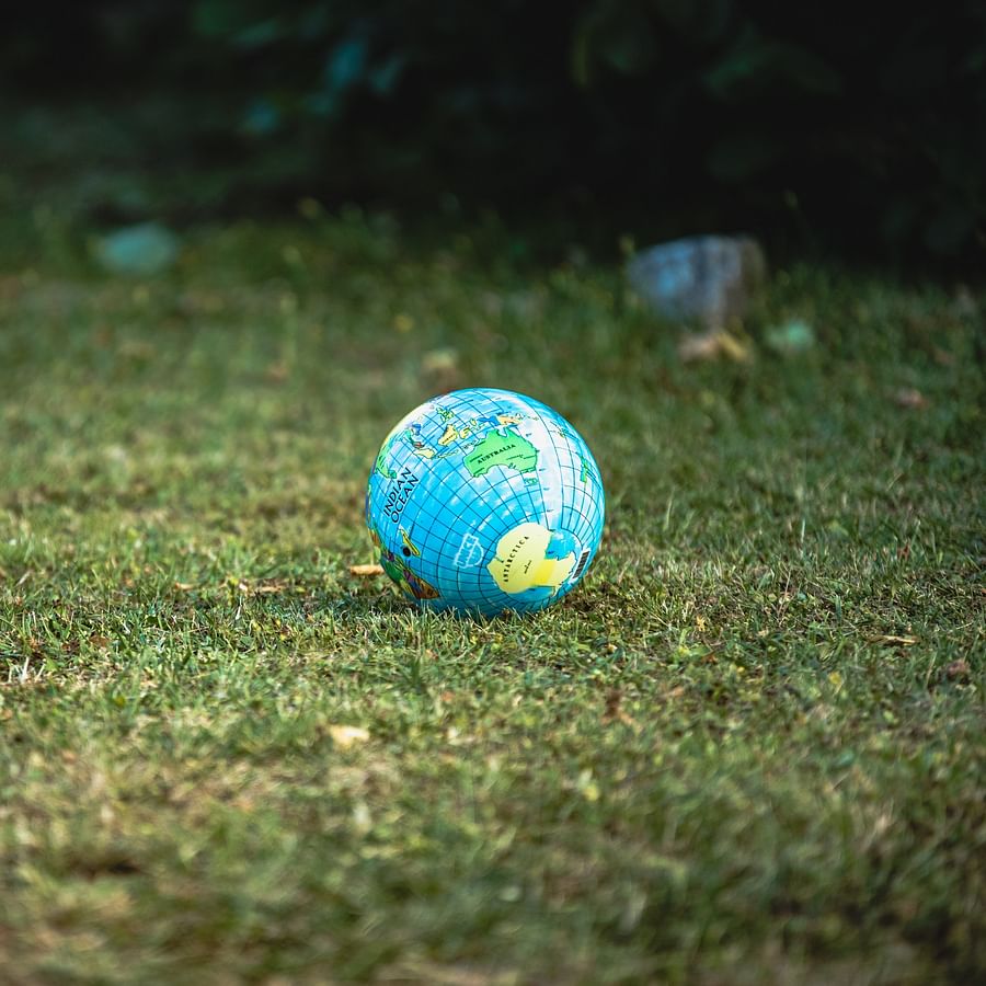Group of joyful people playing bocce ball indoors