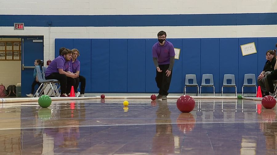 Group of people actively participating in a Bocce Ball tournament